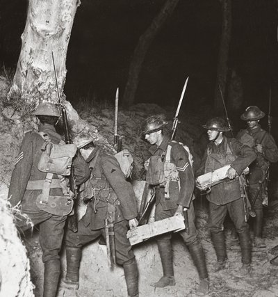 Our troops leaving by a sap on a night operation to cut off the Huns holding on to Villers-Bretonneux, 1918 by English Photographer